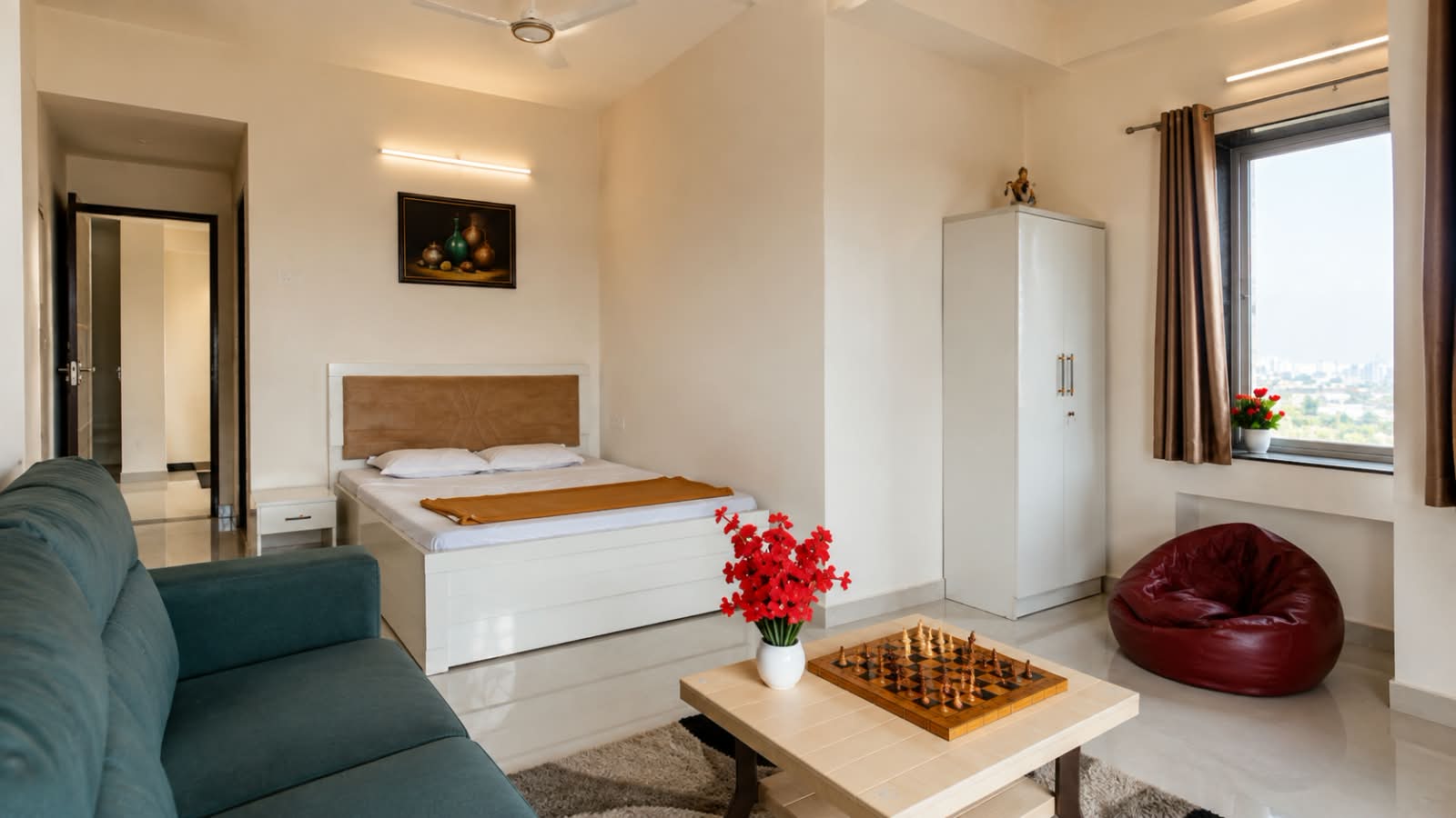 Furnished private room with bed, wardrobe and seating at Shukarana Stays